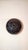 Bud vase by “Vivica and Otto.” Dark copper finish. Flat onion shape typical for their work. Dimensions: 3.25 X 4 inches.