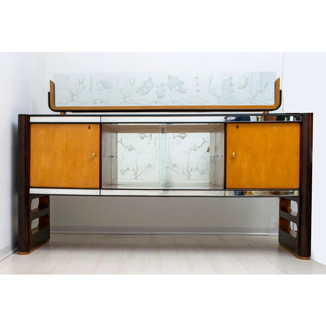 This bar cabinet was produced by Arredamenti Borsani Varedo, Italy, in the 1950s. The cabinet is made of rosewood and...