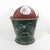 This is a large antique coal scuttle that is well worn, has dents, bumps and at some point a metal patch has been applied...