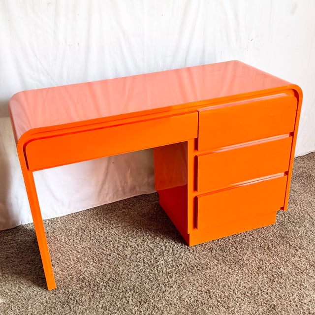 This striking postmodern desk brings bold personality and sculptural presence to any interior. Wrapped in a vibrant...