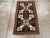 This Mid-20th century Turkish Anatolian rug, measuring 1' 10" x 3' 2", features a bold tribal composition with strong...