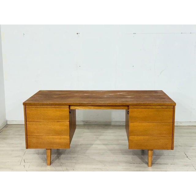 Particularly beautiful, freestanding vintage Ikea desk, distinguished by its striking oak grain and timeless design. with...
