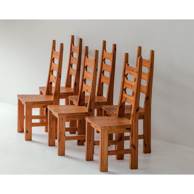 Set of 6 dining chairs produced in Sweden around 1970. High-back dining chairs crafted out of honey coloured solid pine....