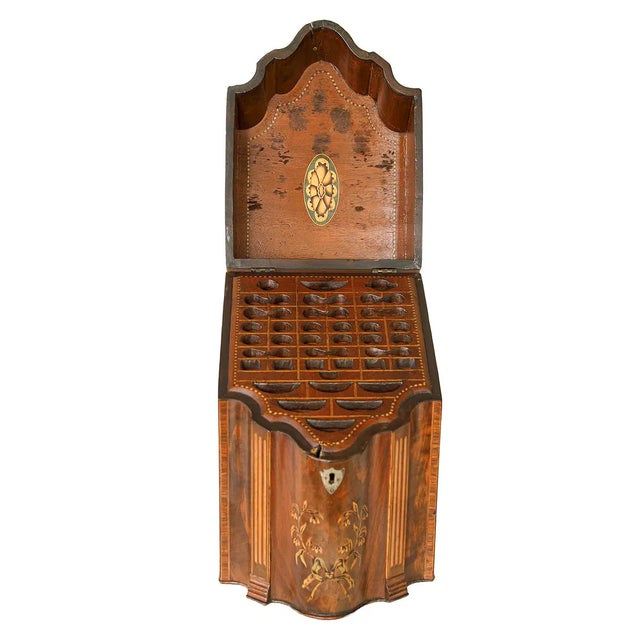A fine mid-19th century English knife box of shaped-front form, crafted in mahogany. The hinged lid features elegant...