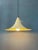 Metal mid century 'witch hat' pendant lamp. The shade is made out of metal and has a white/beige lacquer. The lamp...