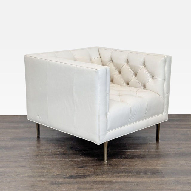 High-end Mila chair by Elite Leather Company, upholstered in premium Grotto ivory leather. Features a tailored modern...