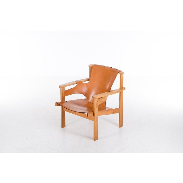 Natural patinated leather and oak. Designed in 1957. Shown at the Triennale in Milan in 1957, since then referred to as...