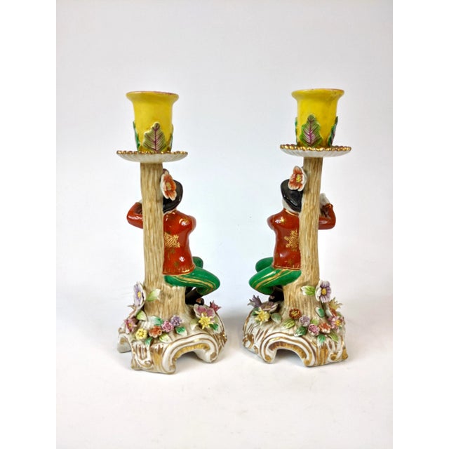This pair of porcelain candle holders are intricately hand painted in fine detail.