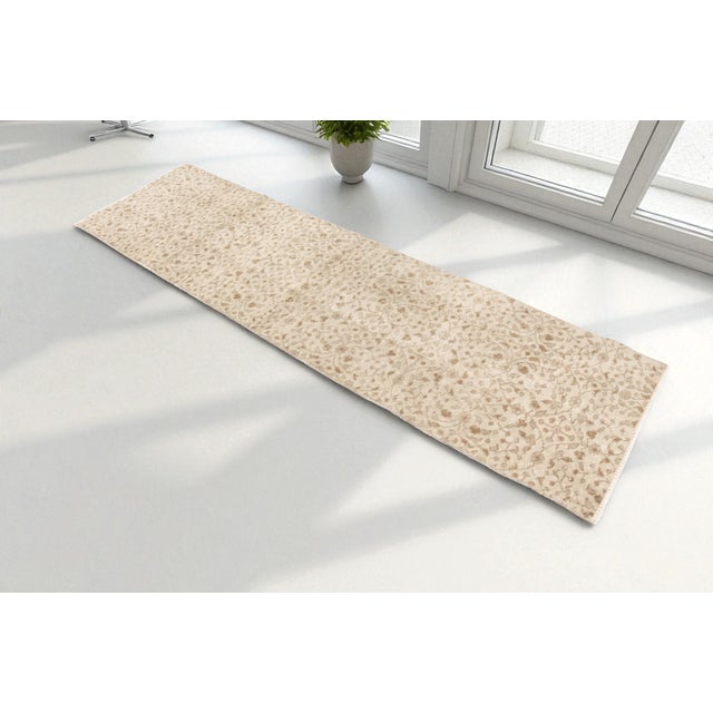 This is a vintage Turkish Oushak rug from the Mid 20th Century. The piece was hand-knotted.