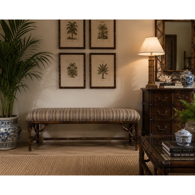 Beautiful vintage McGuire style bench featuring a dark-stained bamboo frame with decorative supports and traditional...