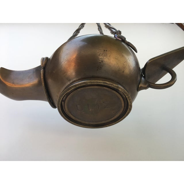 Bronze "Aladdin" Genie Style Ceiling Light. Solid cast brass patina. There are 2 available. Signature unknown. Wired for...
