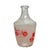 A charming vintage French glass decanter featuring vibrant red illustrations of some of the earliest automobiles,...