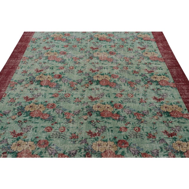 This vintage rug is a 7x10 Turkish distressed piece, made with hand-knotted wool circa mid-20th century. It is an exciting...