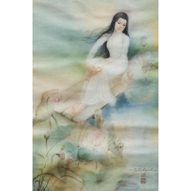 The original silk painting by Vietnamese artist Trần Thị Hiếu Hạnh depicts a young woman dressed in a traditional white áo...