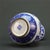The vase is hand-painted in rich cobalt blue against a crisp white ground. The central body features a highly detailed,...