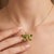 The wings are beautifully brought to life by four brilliant, marquise and pear-cut natural peridot gemstones. The lush,...