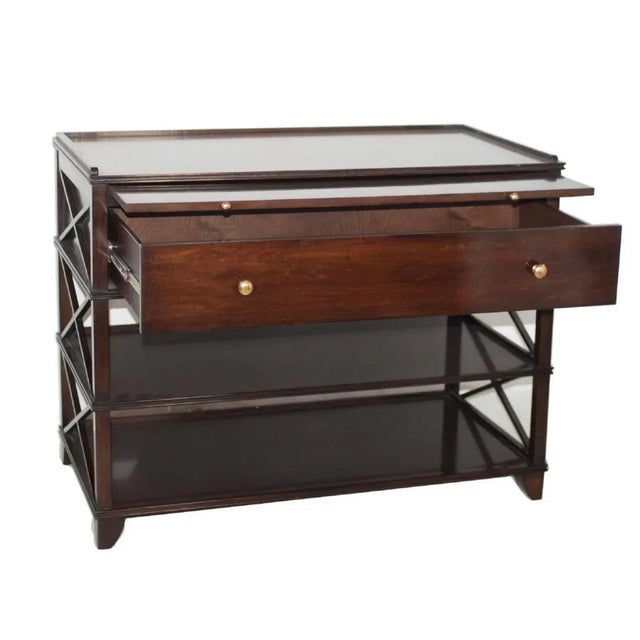 A colette nightstand composed of an overall wooden foundation, designed with two bottom display shelves, topped by a pull...