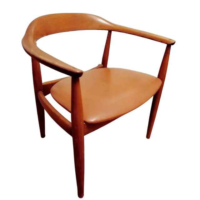 Introducing the Sculptural Danish Elm Armchair by Illum Wikkelso for Niels Eilersen, a Danish design masterpiece. This...