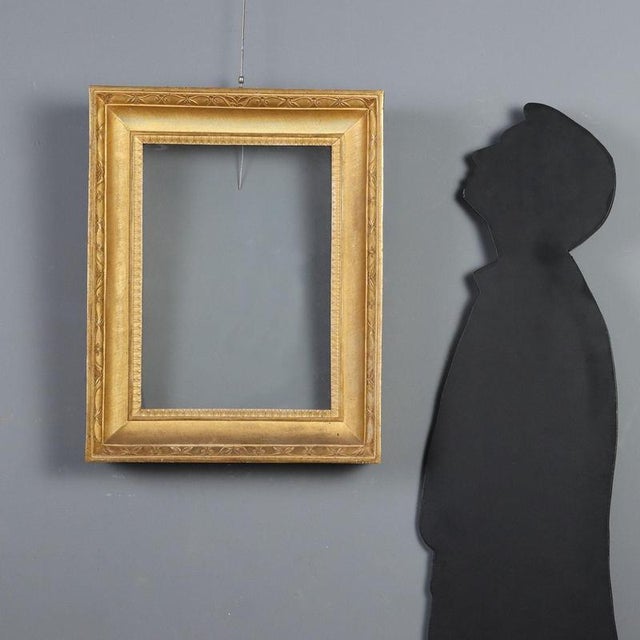 Empire frame in carved and gilded wood, dating back to the early 19th century, originating from Italy. This refined...