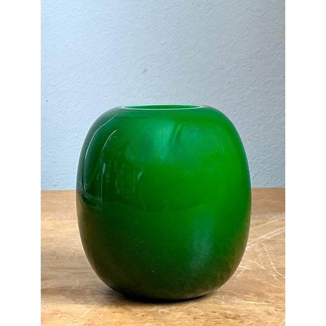 This exquisite vintage art glass bud vase is a masterclass in minimalist design and vibrant color. Expertly hand-blown,...