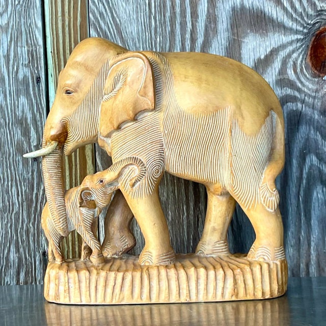 A fabulous vintage Boho elephant and her baby. Gorgeous hand carved detail with an all over white wash finish. Acquired...