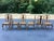 A handsome set of six vintage Queen Anne-style dining chairs featuring beautifully shaped solid wood frames and richly...
