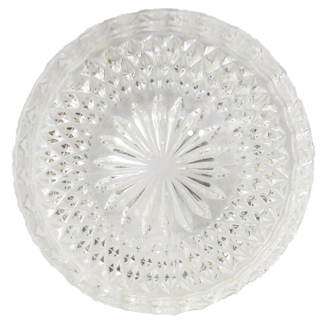 Lovely clear glass coasters with an ovid detailed edge encircling a diamond cut faceted rim which surrounds a sunburst...