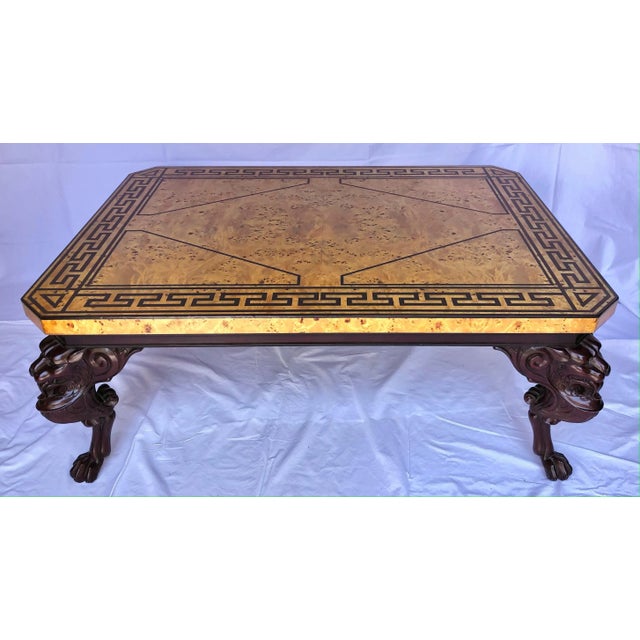 A Vintage 1980's Baker Furniture Neoclassical Cocktail Table with Burled Olive Wood Top and Ebonized Greek Key Design, on...