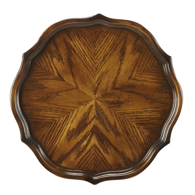 This stately plant stand features an immaculately turned and carved pedestal and stylish cabriole legs. It is handcrafted...