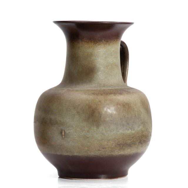 An impressive floor vase made by Steuler in West Germany, 1960s. The glaze is in earth tones, brown with a subtle green...