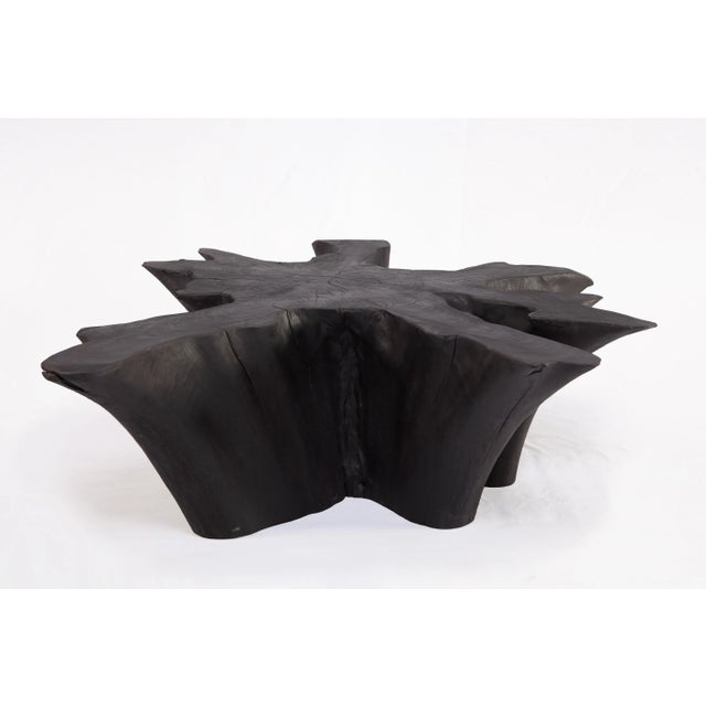 Inspired by the beauty of natural root form, this organic teak table is handcrafted from one piece of salvaged teak root....