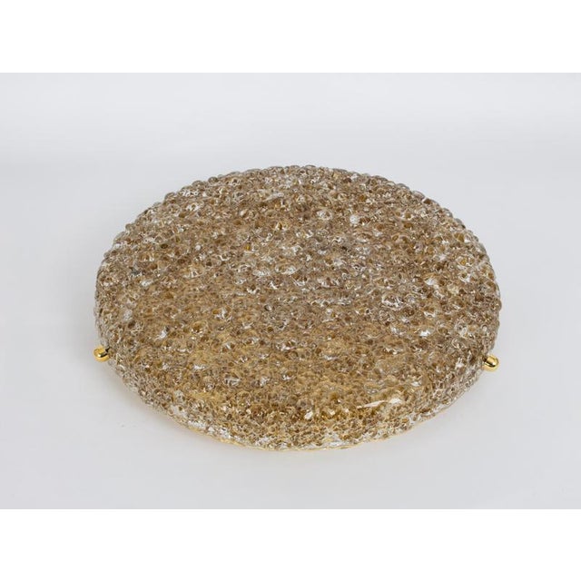 A wonderful round murano flush mount by hillebrand leuchten, germany, 1970s. Thick textured murano fixture on a brass base...