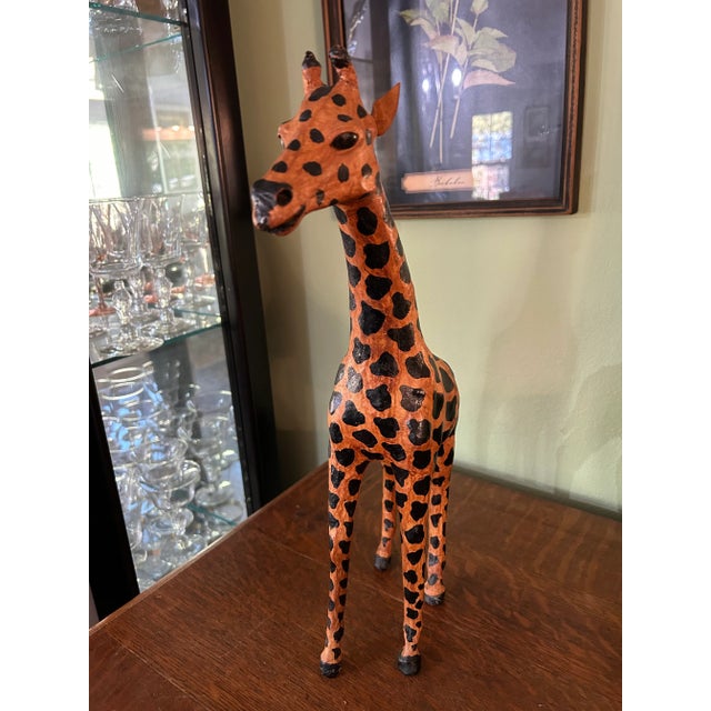 This leather giraffe was probably made in India as one of the pieces of leather wrapped Papier-mâché popular in the late...