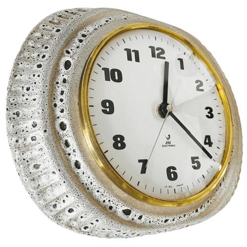 Bring the ultimate 70s vibe into your home with this beautiful vintage wall clock from the renowned French brand Jaz...