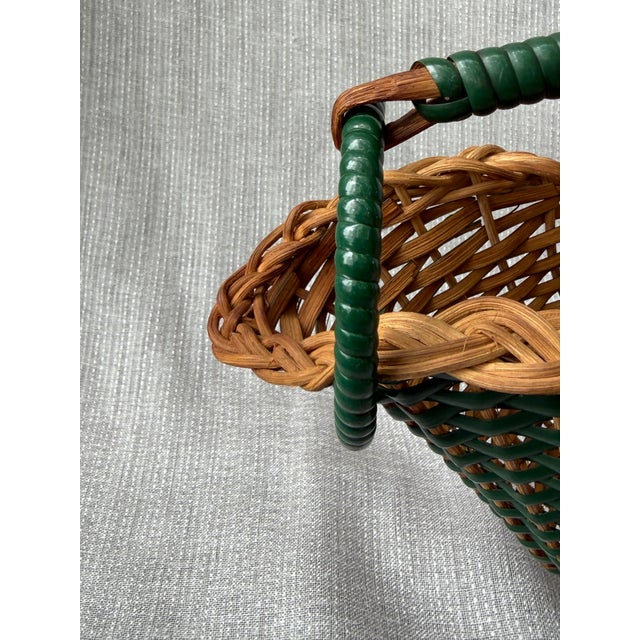 Vintage French woven green and natural wicker wine bottle holder, caddy. Top handle with a large ring at the front for...