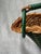 Vintage French woven green and natural wicker wine bottle holder, caddy. Top handle with a large ring at the front for...