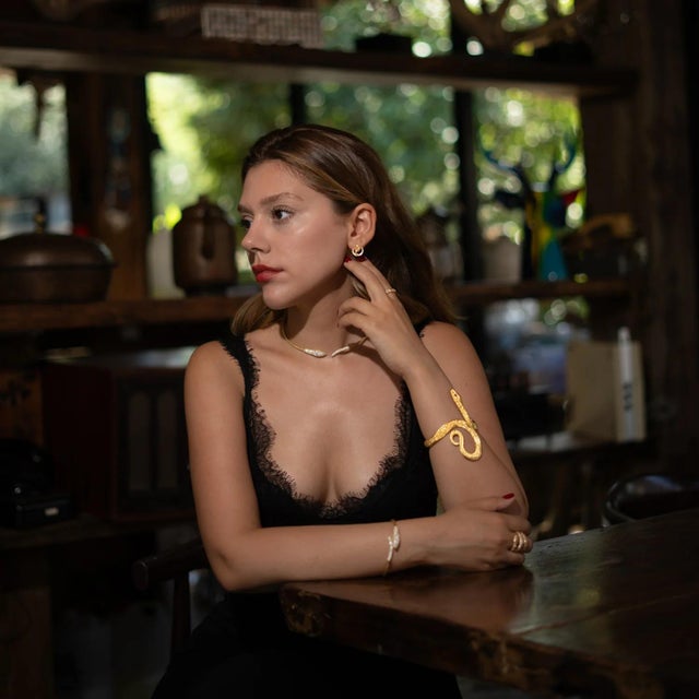 Channel the ancient power of transformation and protection with the Mystic Snake Guardian Gold Chunky Adjustable Cuff...