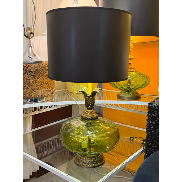 1960s green pressed glass orb lamp. Rewired and restored with all brass appointments including the brass finished textured...