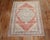 mid-20th-century Turkish Sivas rug with an open field medallion design in muted red.. The medallion and border is gray....