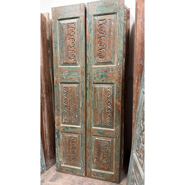 Bring timeless character to your space with these antique rustic double doors featuring beautifully hand-carved floral...