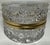 A sparkling cut crystal keepsake box with elegant gold-tone trim—timeless glamour for a vanity or coffee table. Elevate...