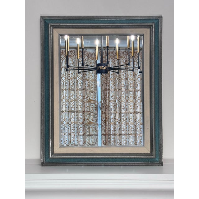 This vintage-style rectangular wall mirror features a classic multi-tiered frame design balancing traditional character...