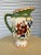 Beautiful colorful Floral ceramic pitcher with green border. Floral Made by Pamela Gladding. Pattern name wildflowers....