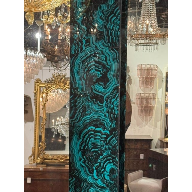 This product is a pair of octagonal reverse painted malachite mirrors, featuring intricate designs of green and black on...