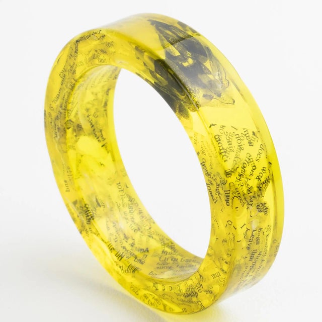 This stunning John Galliano Paris bracelet is from the 2000 Autumn-Winter "Newspaper" collection. The bangle features an...