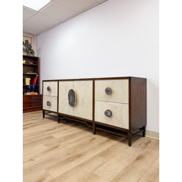 This striking credenza by John Richard is a true statement piece, featuring genuine amethyst geode stone detailing across...