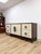 This striking credenza by John Richard is a true statement piece, featuring genuine amethyst geode stone detailing across...