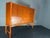 A, exceptional teak and beech wood high sideboard or cabinet, model “Napoli”. Designed by the Swedish furniture designer...