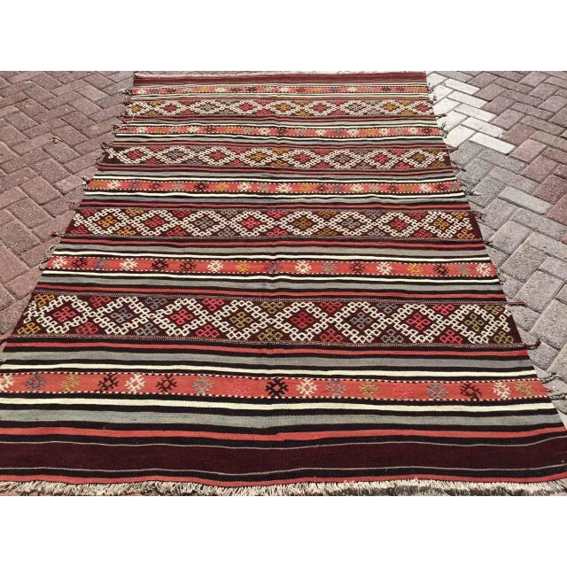 This beautiful, vintage, handwoven kilim is approximately 50 years old. It is handmade, of very fine quality hand spun...