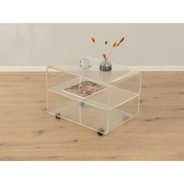 Wonderful side table from the 1960s in the style of Michel Dumas. High-quality frame and base made of transparent acrylic...